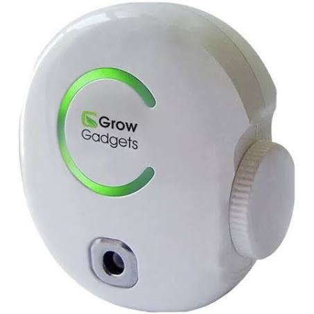 A white plug-in ozone generator with a green light ring and the brand name 'Grow Gadgets' on the front.